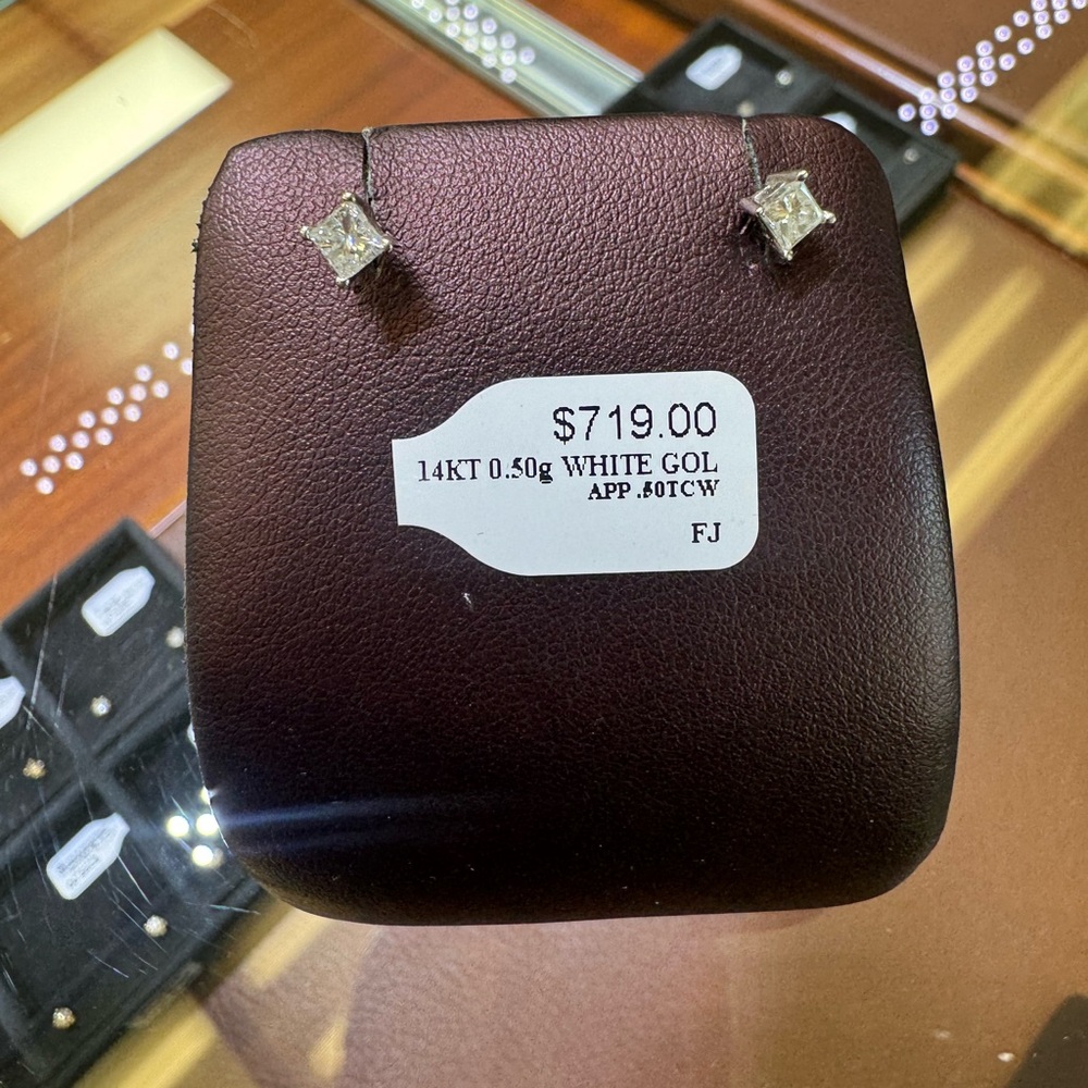 Single princess cut diamond earrings (and one round)
